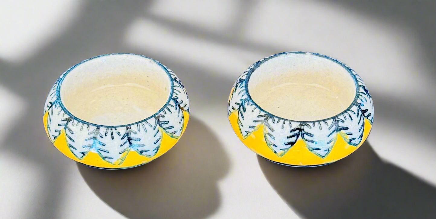 Handcrafted Jaipur Blue Pottery tea light holders, featuring intricate designs and vibrant blue hues, adding a traditional Indian touch to your home decor.