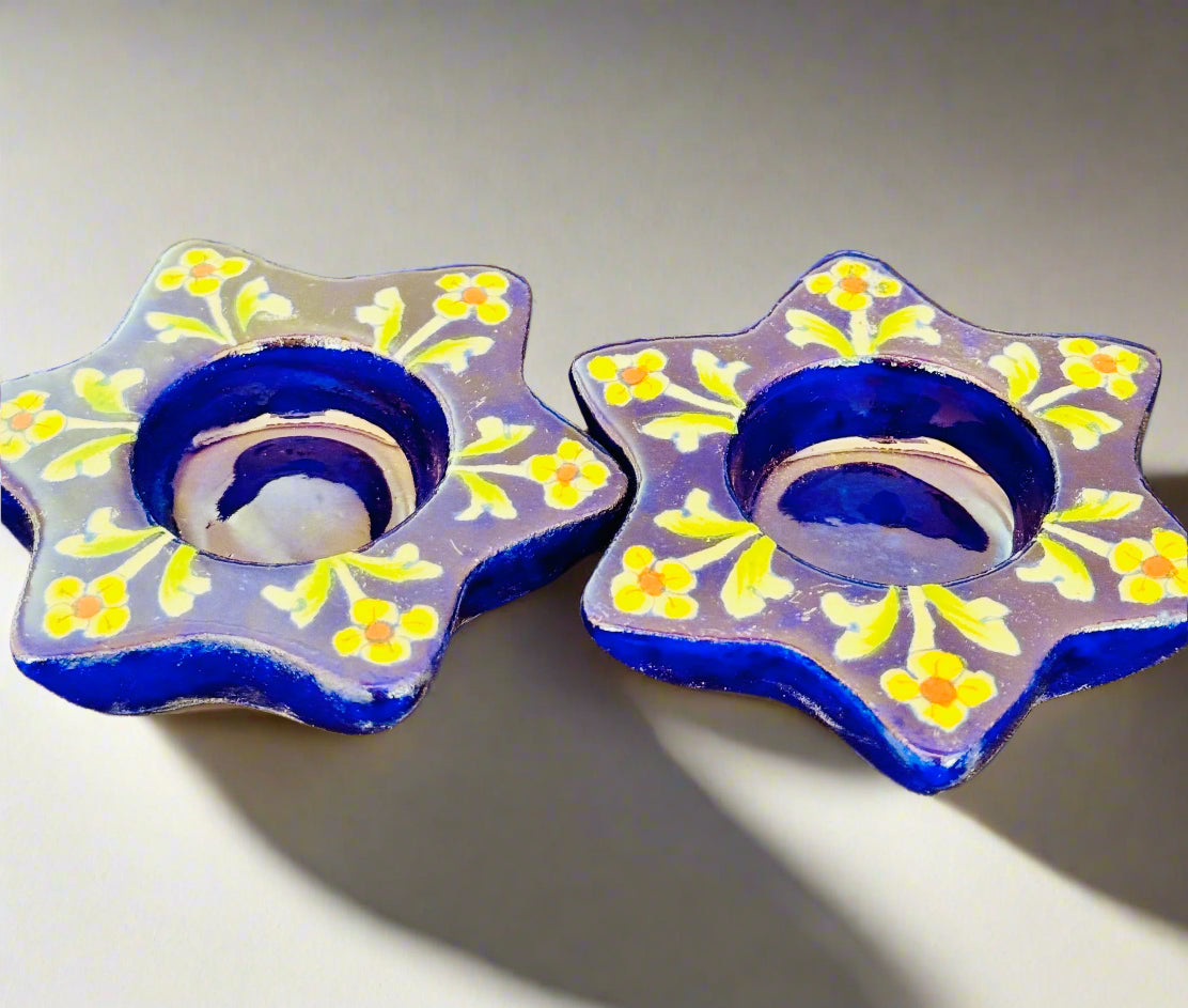 Handcrafted Jaipur Blue Pottery tea light holders, featuring intricate designs and vibrant blue hues, adding a traditional Indian touch to your home decor.