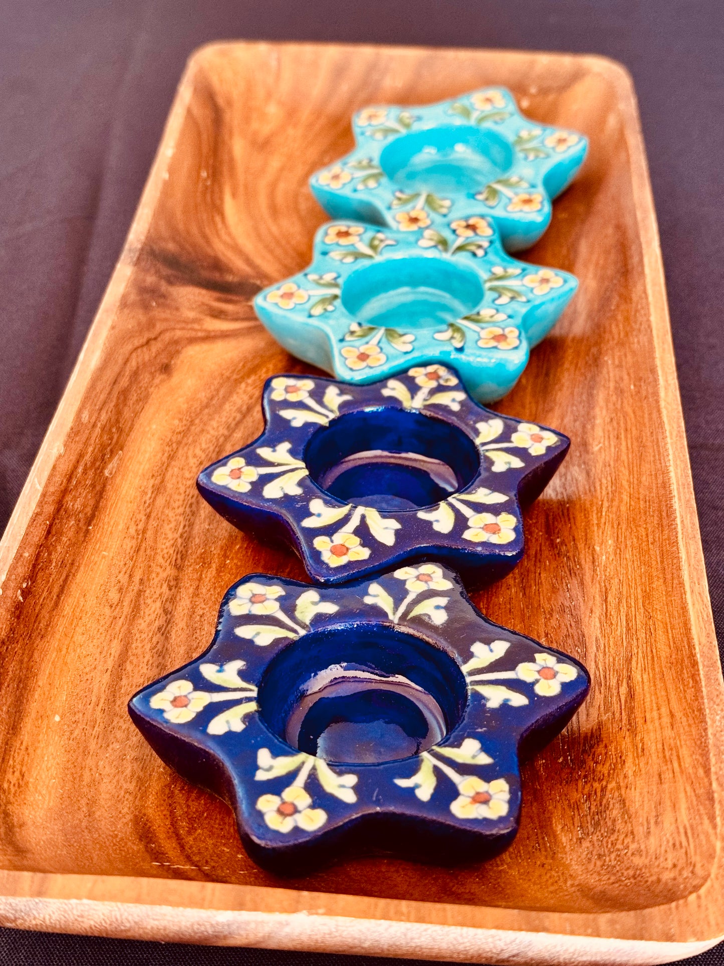 Handcrafted Jaipur Blue Pottery tea light holders, featuring intricate designs and vibrant blue hues, adding a traditional Indian touch to your home decor.