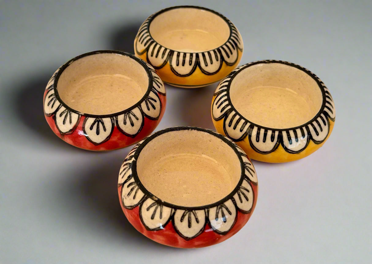 Handcrafted Jaipur Blue Pottery tea light holders, featuring intricate designs and vibrant blue hues, adding a traditional Indian touch to your home decor.