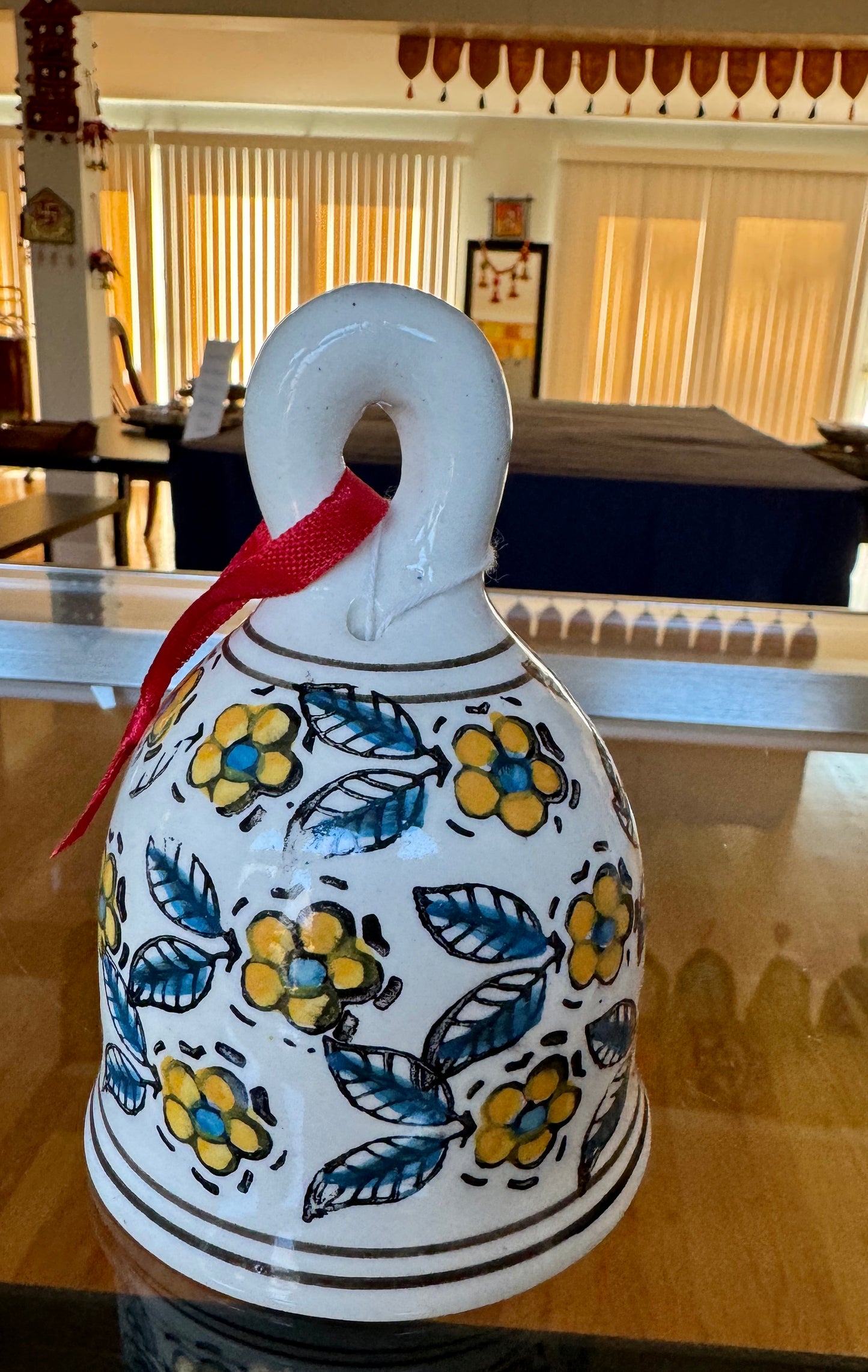Handcrafted Jaipur Blue Pottery bells, featuring intricate designs and vibrant colors, perfect for adding a festive, traditional Indian touch to your Christmas and holiday decor.