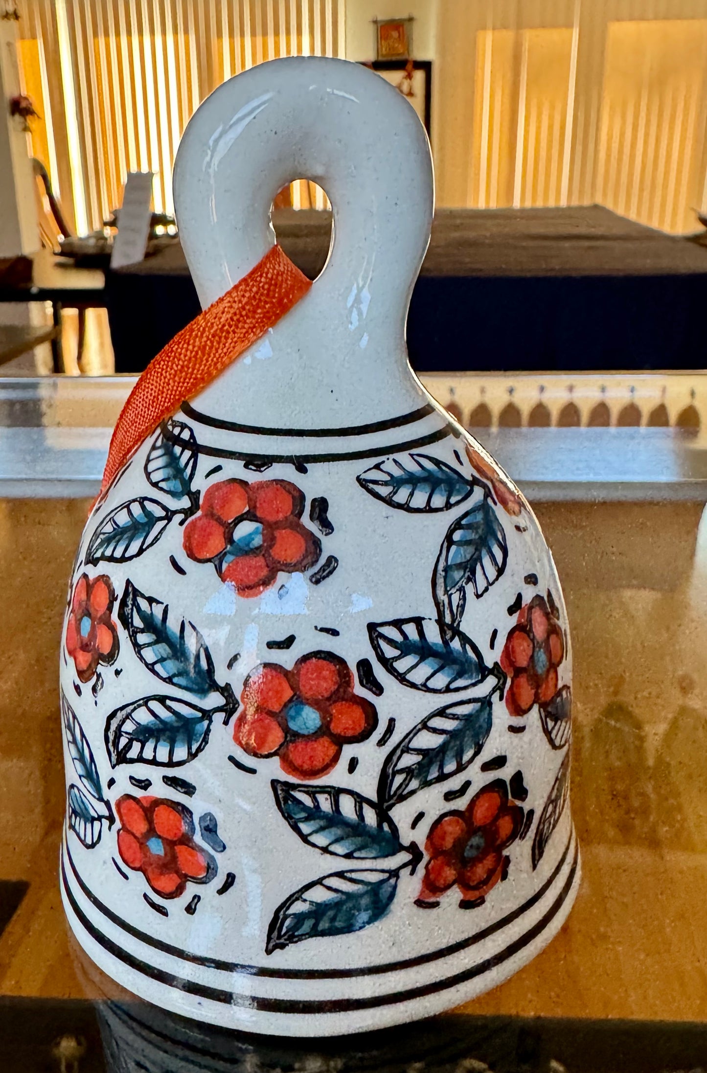 Handcrafted Jaipur Blue Pottery bells, featuring intricate designs and vibrant colors, perfect for adding a festive, traditional Indian touch to your Christmas and holiday decor.