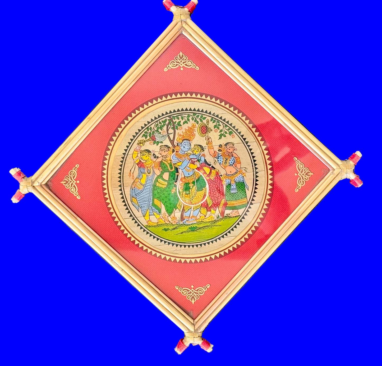 Decorative wall hanging with a colorful design on a blue background