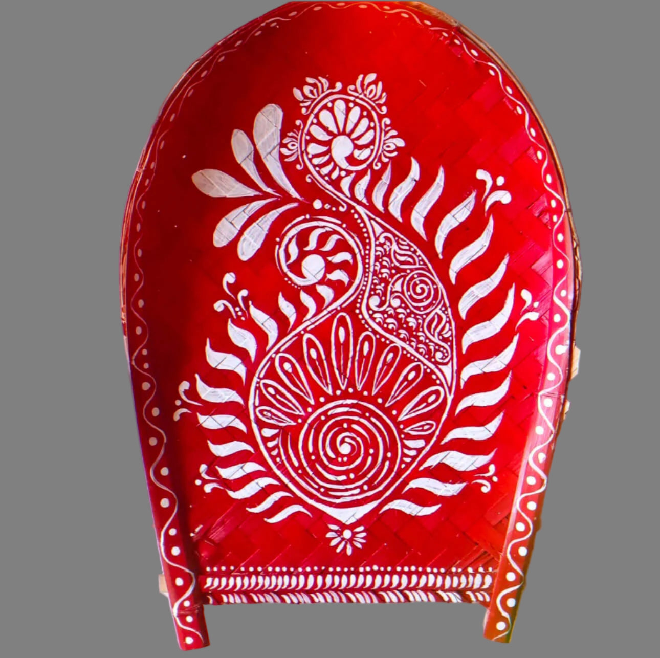 Hand-painted Alpona art on Kulo baskets, featuring intricate Bengali motifs in traditional, flowing patterns.