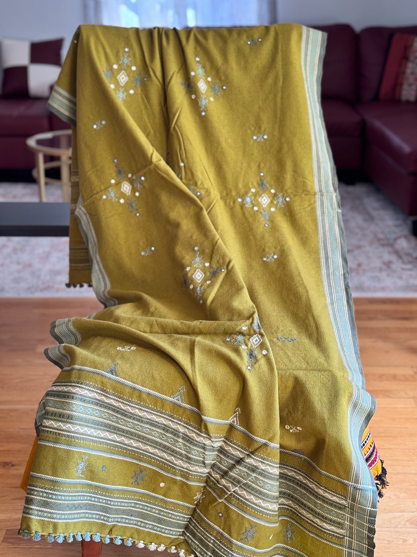Handcrafted Kutchi embroidery pure sheep wool shawls, featuring intricate traditional patterns and vibrant threads, offering warmth and elegance with a cultural touch.