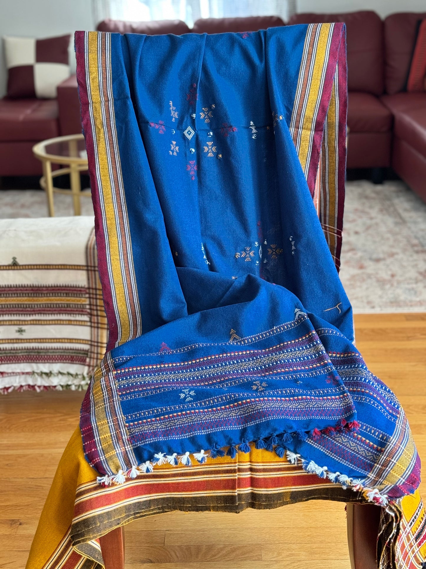 Handcrafted Kutchi embroidery pure sheep wool shawls, featuring intricate traditional patterns and vibrant threads, offering warmth and elegance with a cultural touch.