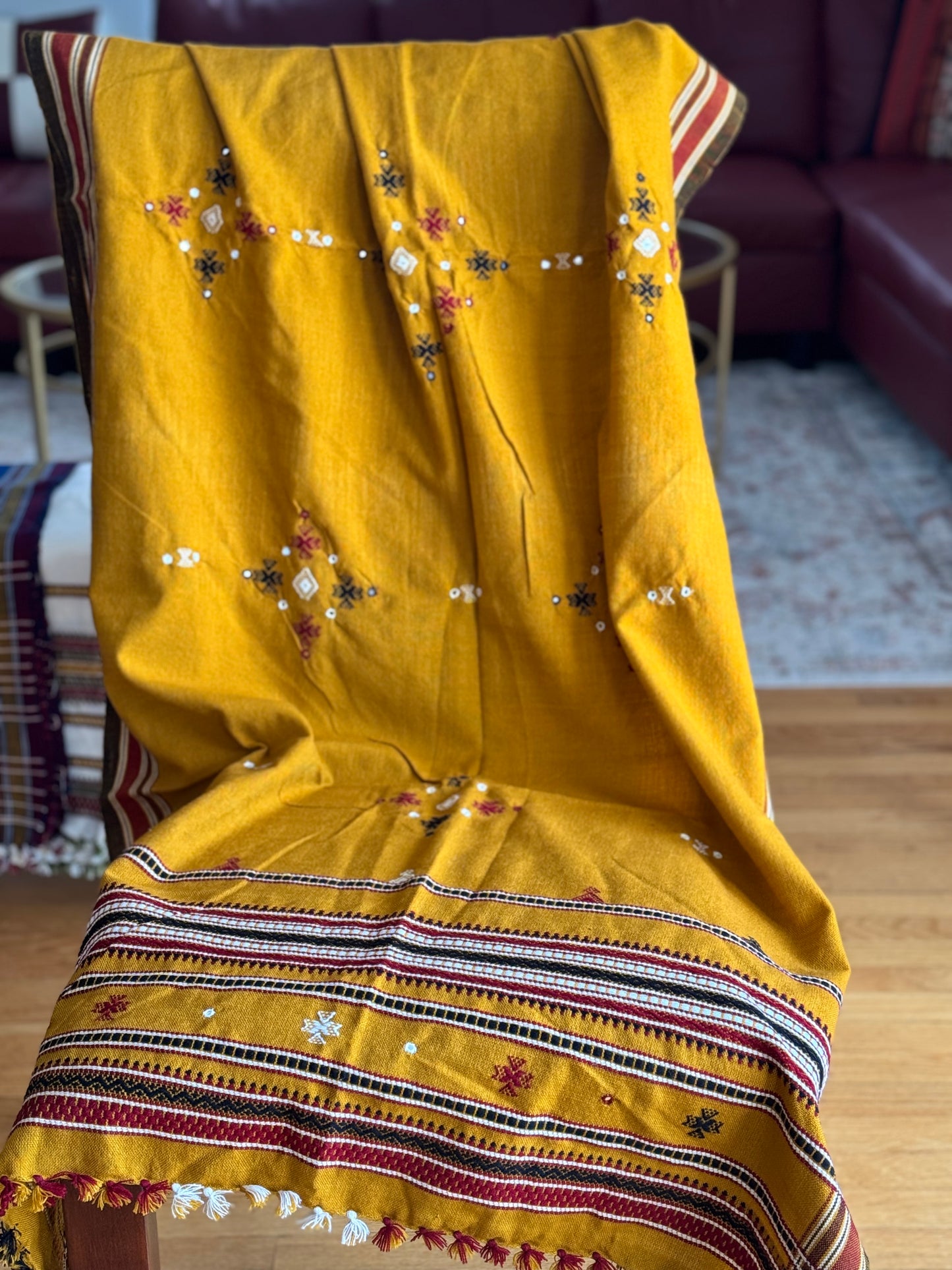 Handcrafted Kutchi embroidery pure sheep wool shawls, featuring intricate traditional patterns and vibrant threads, offering warmth and elegance with a cultural touch.