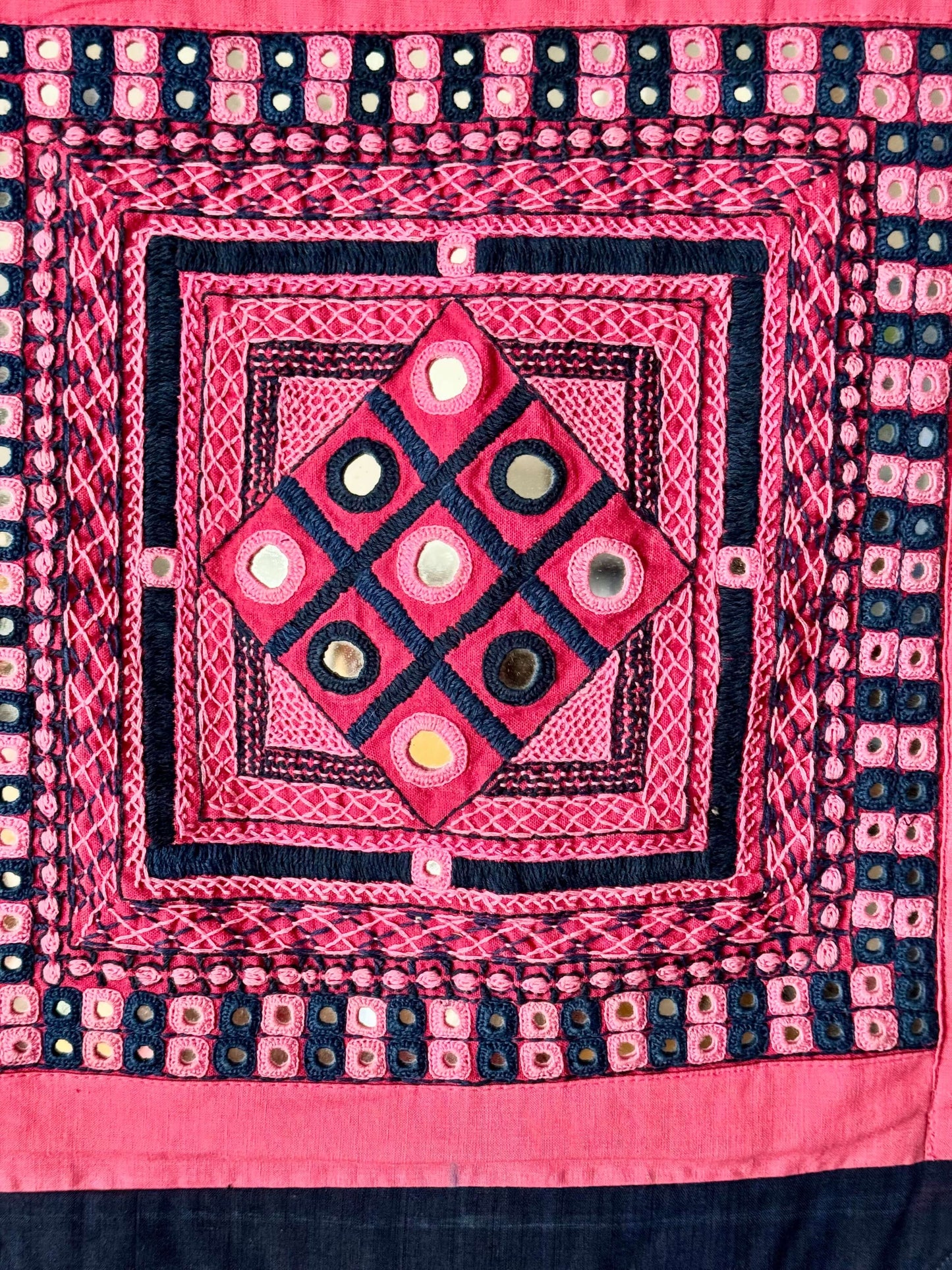 Handcrafted Lambani work textile wall decor, featuring intricate embroidery, mirror work, and vibrant patterns. A stunning display of traditional craftsmanship, adding cultural richness and texture to your space.