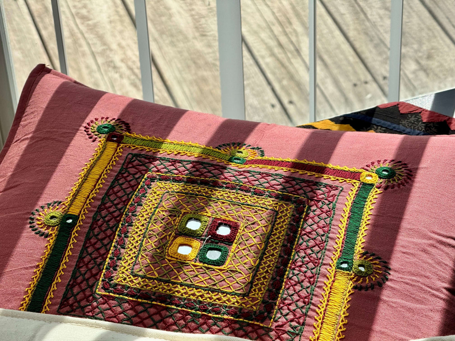 Handcrafted Lambani work on cushion covers, featuring intricate embroidery and vibrant patterns. A beautiful display of traditional craftsmanship, adding a touch of cultural elegance to your home decor.