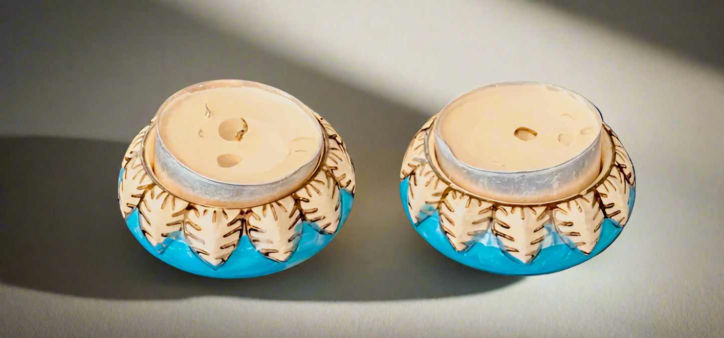 Handcrafted Jaipur Blue Pottery tea light holders, featuring intricate designs and vibrant blue hues, adding a traditional Indian touch to your home decor.