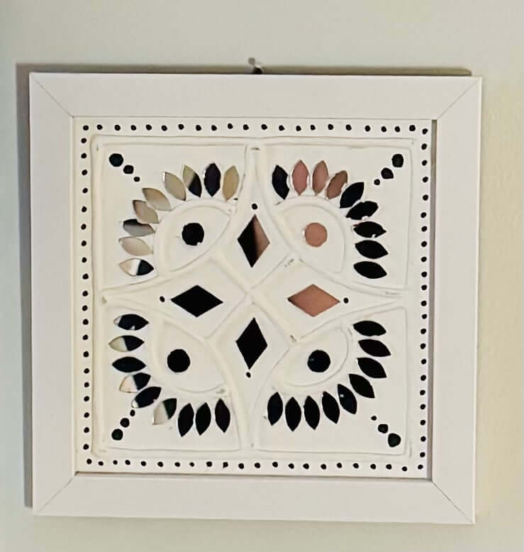 Handcrafted Lippankaam (Mud and Mirror Work) wall decor, featuring intricate mirror designs and textured mud patterns, adding a rustic and traditional Indian touch to your space.