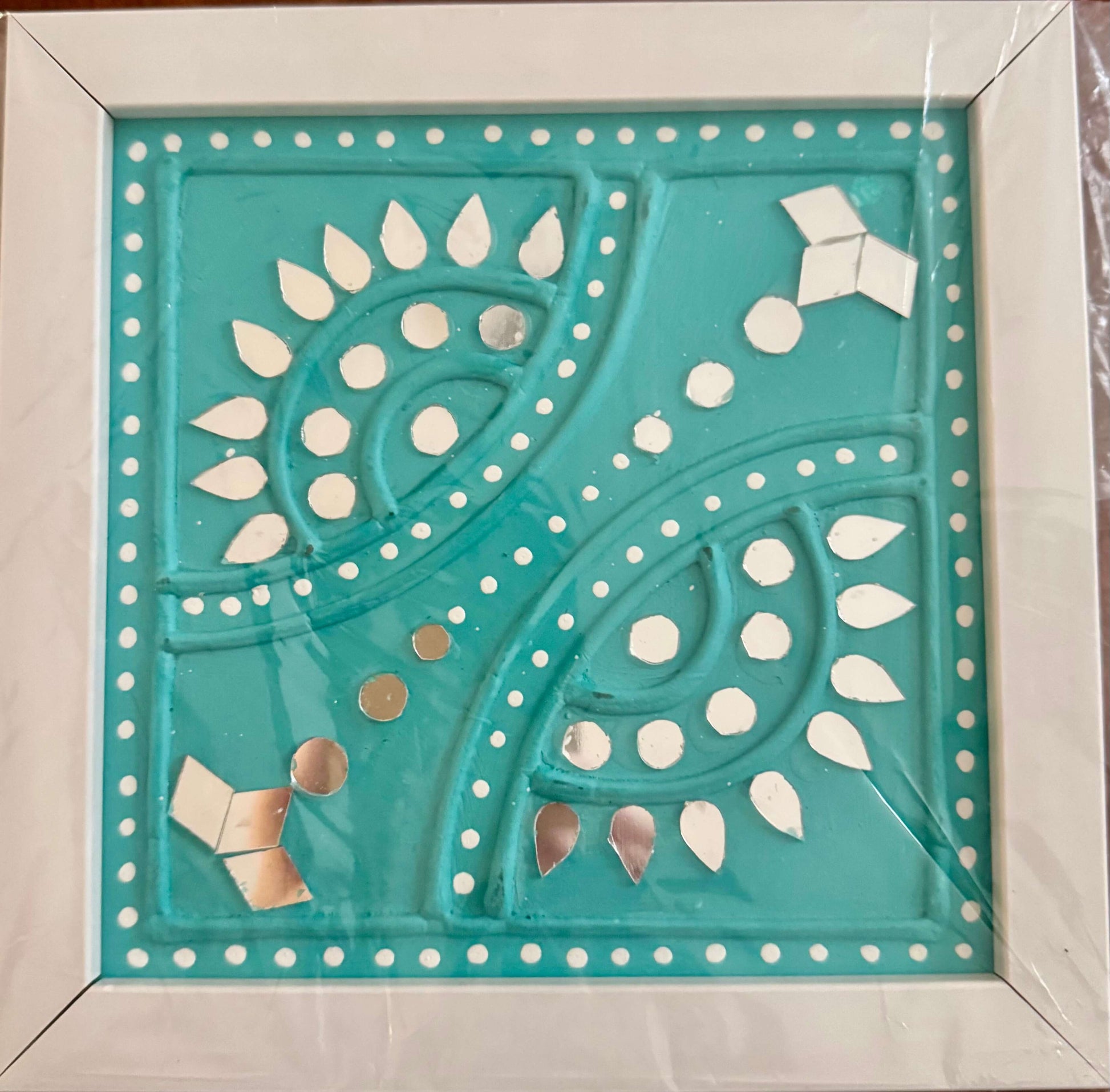 Handcrafted Lippankaam (Mud and Mirror Work) wall decor, featuring intricate mirror designs and textured mud patterns, adding a rustic and traditional Indian touch to your space.