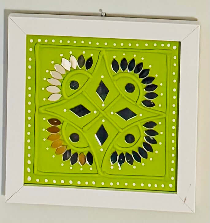 Handcrafted Lippankaam (Mud and Mirror Work) wall decor, featuring intricate mirror designs and textured mud patterns, adding a rustic and traditional Indian touch to your space.
