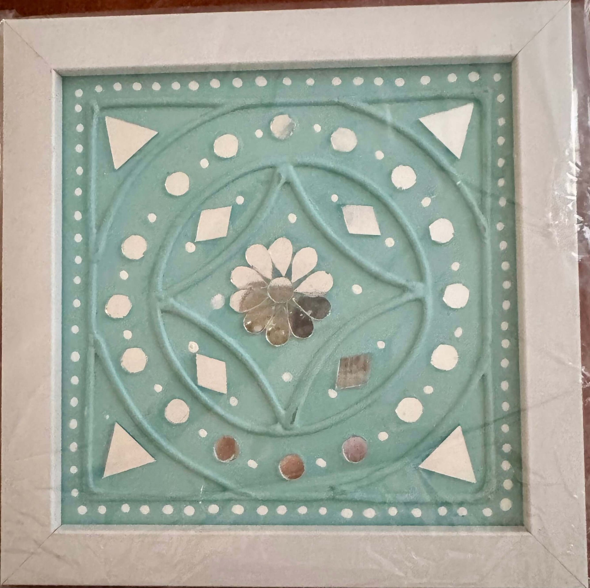 Handcrafted Lippankaam (Mud and Mirror Work) wall decor, featuring intricate mirror designs and textured mud patterns, adding a rustic and traditional Indian touch to your space.