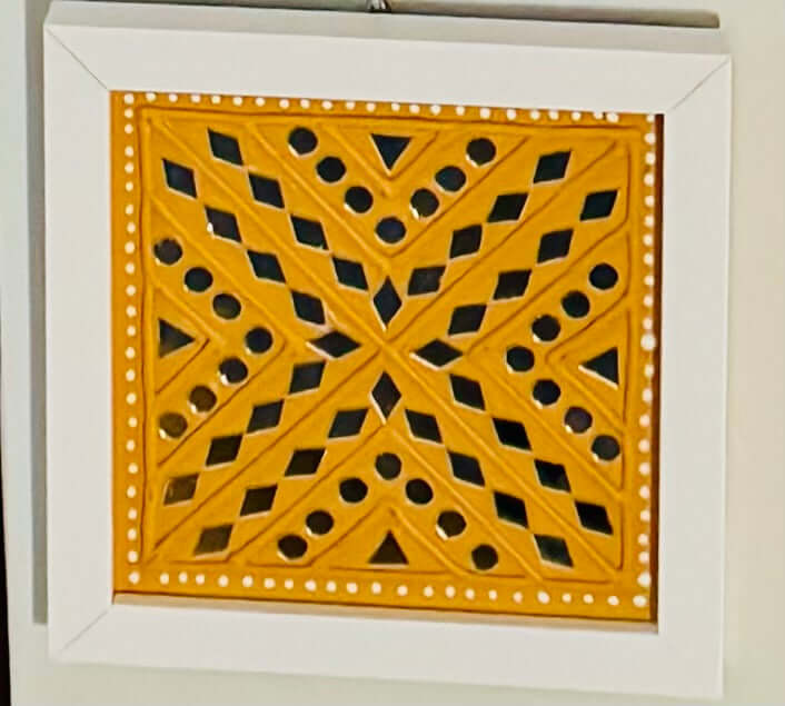 Handcrafted Lippankaam (Mud and Mirror Work) wall decor, featuring intricate mirror designs and textured mud patterns, adding a rustic and traditional Indian touch to your space.
