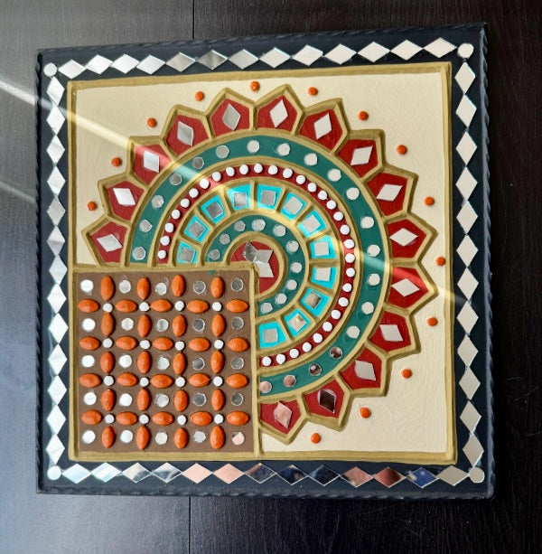 Decorative Lippankaam wall art with geometric pattern on a dark surface