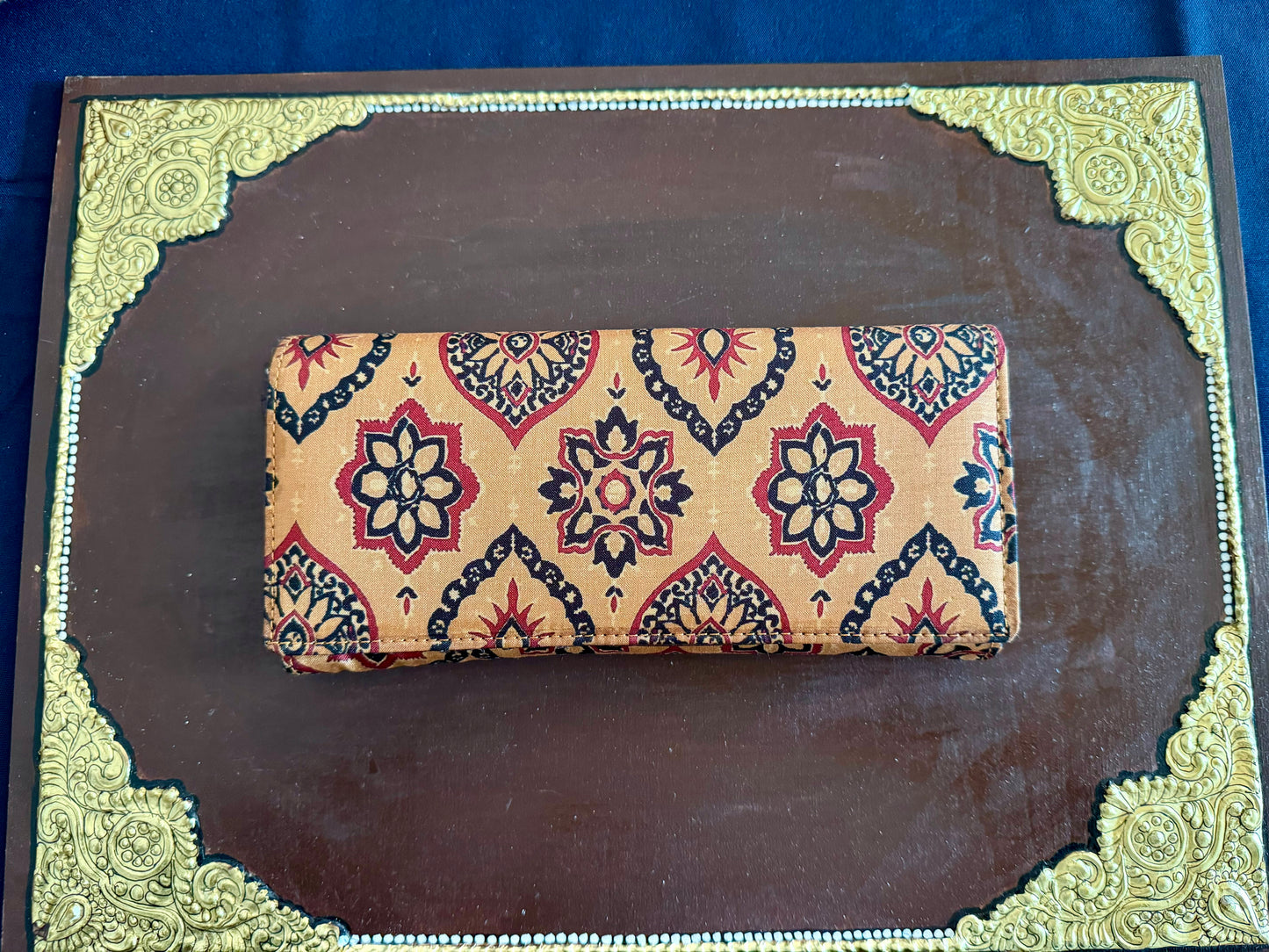 Eco-friendly upcycled fabric wallets with magnetic closure, featuring vibrant patterns and durable stitching, combining sustainability with style.