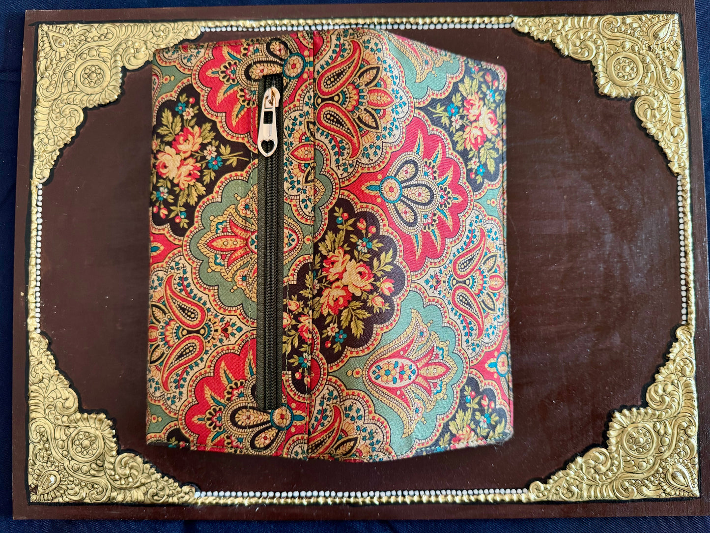 Eco-friendly upcycled fabric wallets with magnetic closure, featuring vibrant patterns and durable stitching, combining sustainability with style.