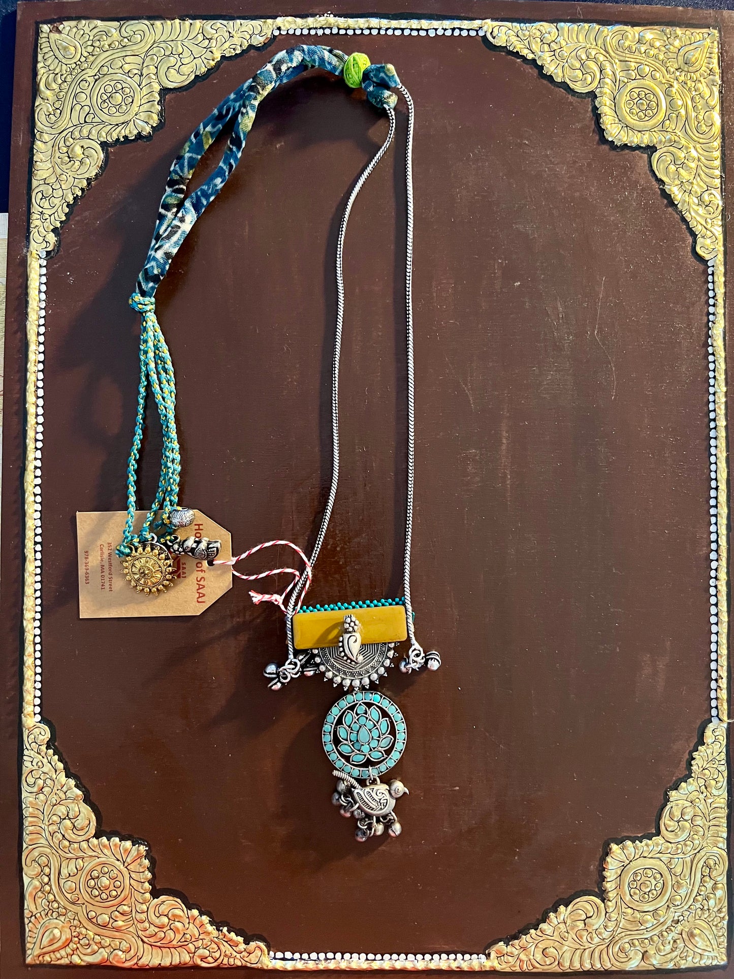 Eco-friendly upcycled handmade medium-sized pendant necklaces, featuring unique designs and sustainable materials, blending style with environmental consciousness.