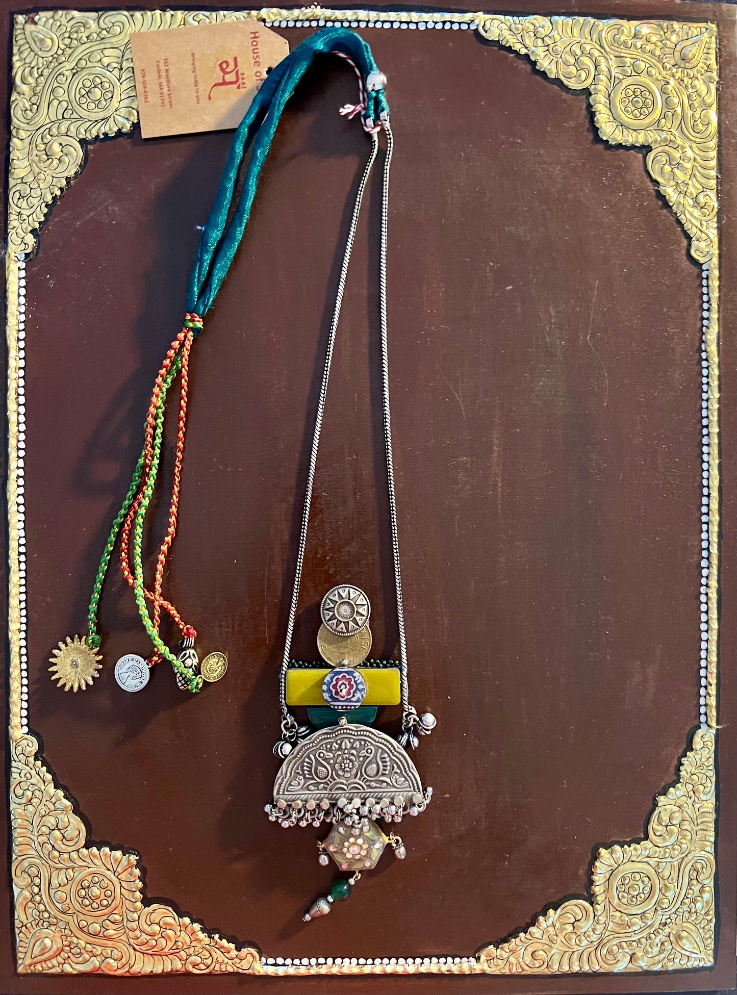 Eco-friendly upcycled handmade medium-sized pendant necklaces, featuring unique designs and sustainable materials, blending style with environmental consciousness.