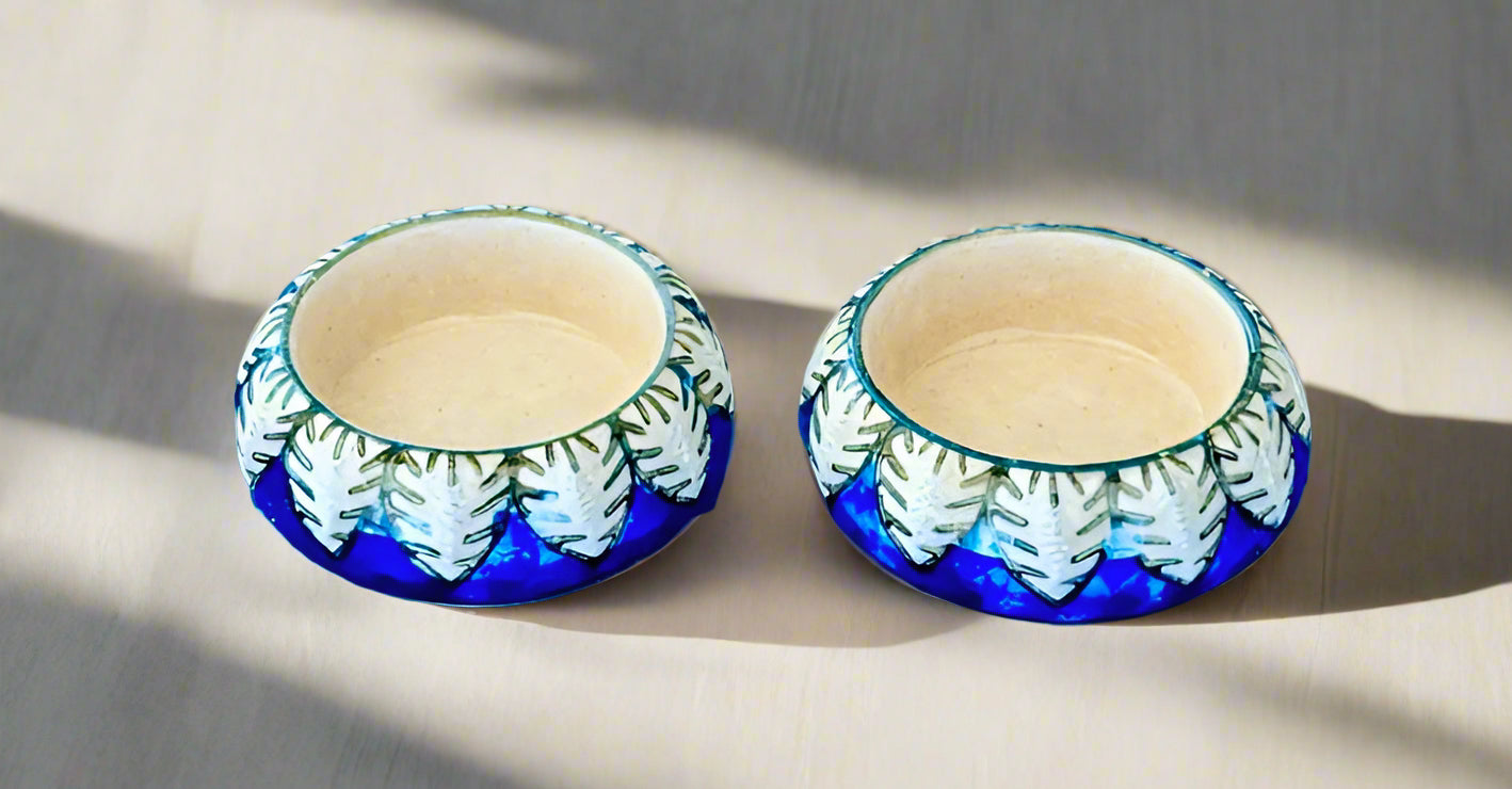 Handcrafted Jaipur Blue Pottery tea light holders, featuring intricate designs and vibrant blue hues, adding a traditional Indian touch to your home decor.