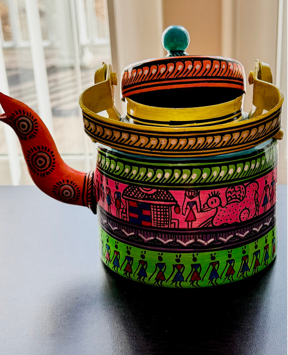 Exquisite Pattachitra art hand-painted on decorative items like Suparis, coconut balls, tea kettles, small Kulo baskets, and miniature mandirs. A vibrant showcase of intricate craftsmanship and cultural heritage for unique home decor.