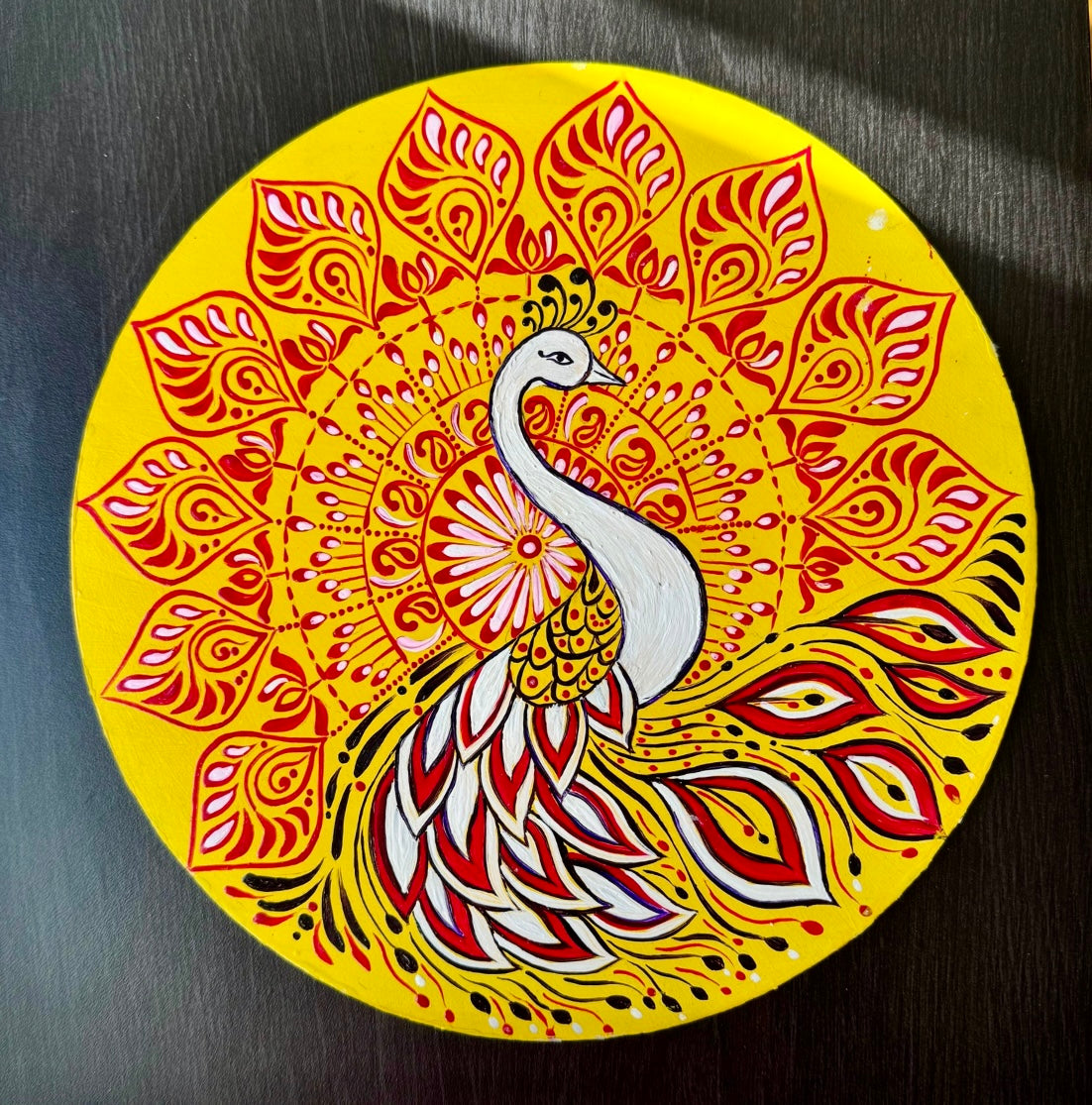 Hand-painted Alpona wall decor plate featuring intricate traditional motifs inspired by Bengali folk art. A stunning blend of cultural heritage and craftsmanship to elevate your home decor.