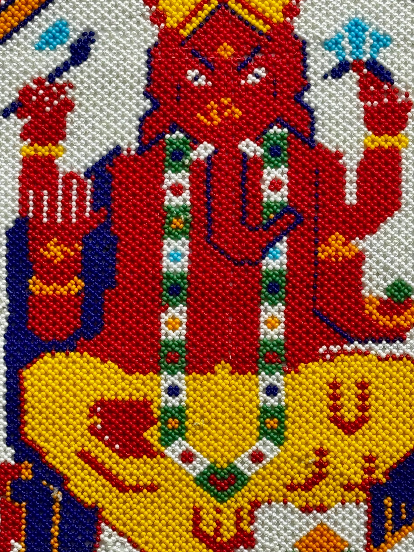 Decorative Motikaam with a Ganesh on a white background