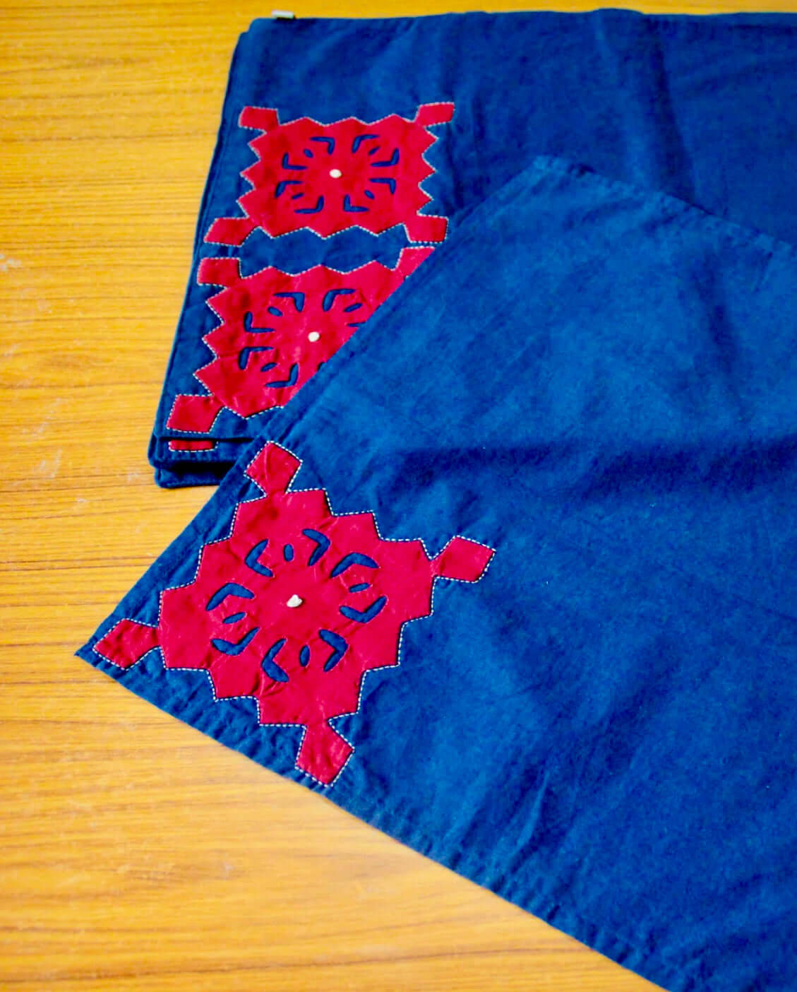 Handcrafted Appliqué work on placemats and napkins set, featuring intricate designs and vibrant colors. A beautiful fusion of traditional craftsmanship and modern elegance to enhance your dining experience.