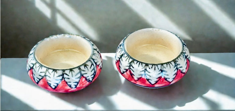 Handcrafted Jaipur Blue Pottery tea light holders, featuring intricate designs and vibrant blue hues, adding a traditional Indian touch to your home decor.