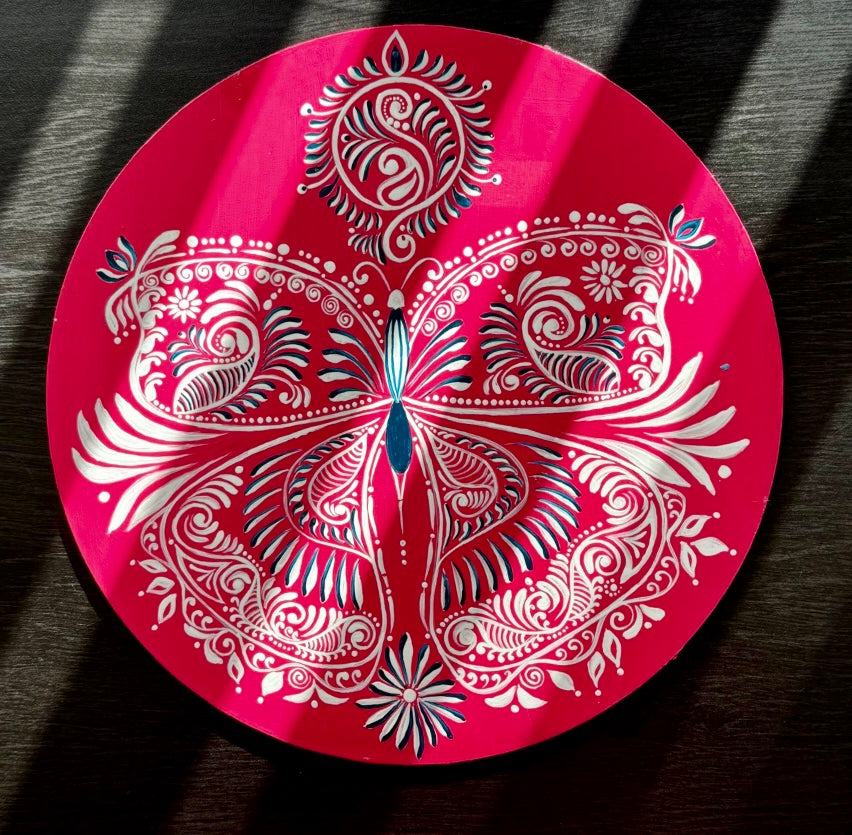 Hand-painted Alpona wall decor plate featuring intricate traditional motifs inspired by Bengali folk art. A stunning blend of cultural heritage and craftsmanship to elevate your home decor.