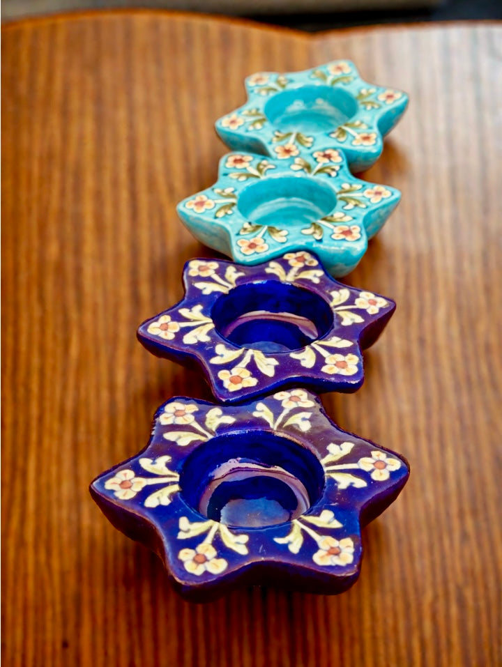 Handcrafted Jaipur Blue Pottery tea light holders, featuring intricate designs and vibrant blue hues, adding a traditional Indian touch to your home decor.