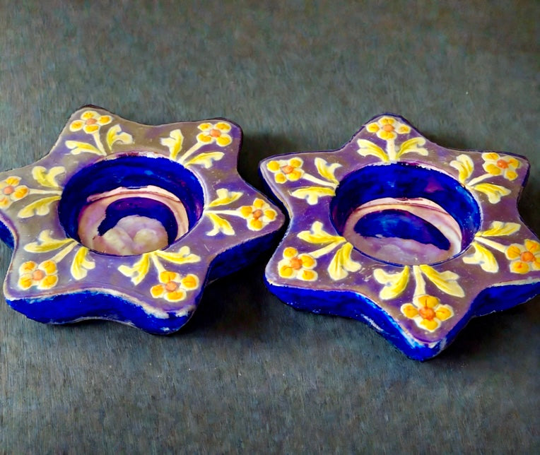 Handcrafted Jaipur Blue Pottery tea light holders, featuring intricate designs and vibrant blue hues, adding a traditional Indian touch to your home decor.