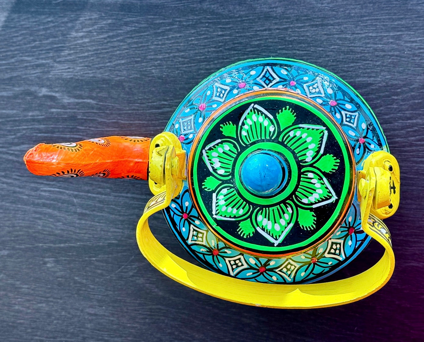 Exquisite Pattachitra art hand-painted on decorative items like Suparis, coconut balls, tea kettles, small Kulo baskets, and miniature mandirs. A vibrant showcase of intricate craftsmanship and cultural heritage for unique home decor.