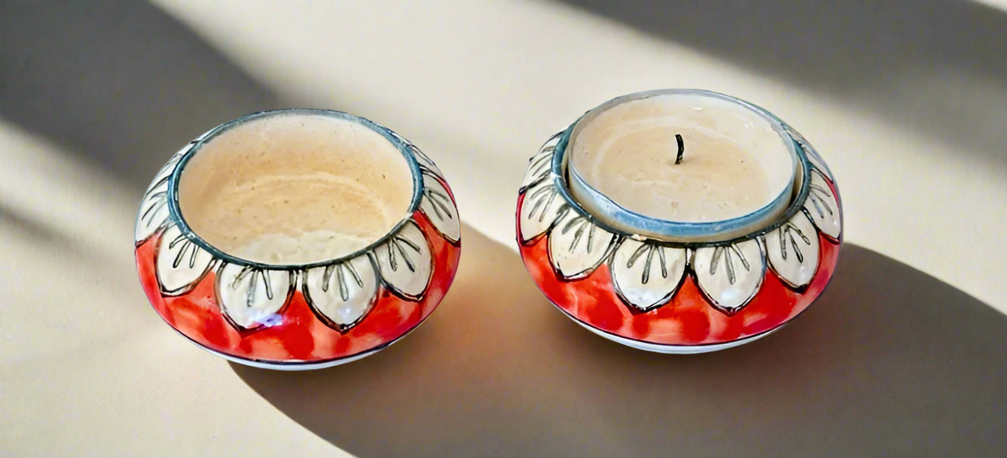 Handcrafted Jaipur Blue Pottery tea light holders, featuring intricate designs and vibrant blue hues, adding a traditional Indian touch to your home decor.