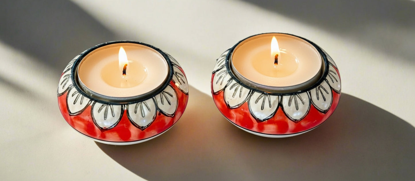 Handcrafted Jaipur Blue Pottery tea light holders, featuring intricate designs and vibrant blue hues, adding a traditional Indian touch to your home decor.