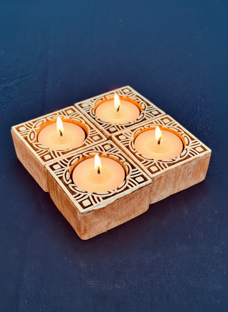 Hand-carved wooden tea light holders in various shapes, featuring intricate designs and natural finishes, adding a rustic, artisanal touch to your home decor.