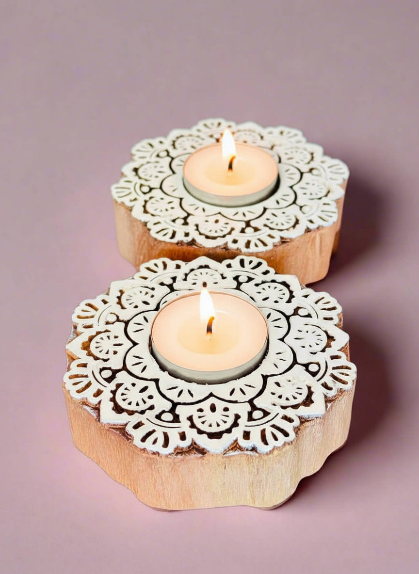 Hand-carved wooden tea light holders in various shapes, featuring intricate designs and natural finishes, adding a rustic, artisanal touch to your home decor.