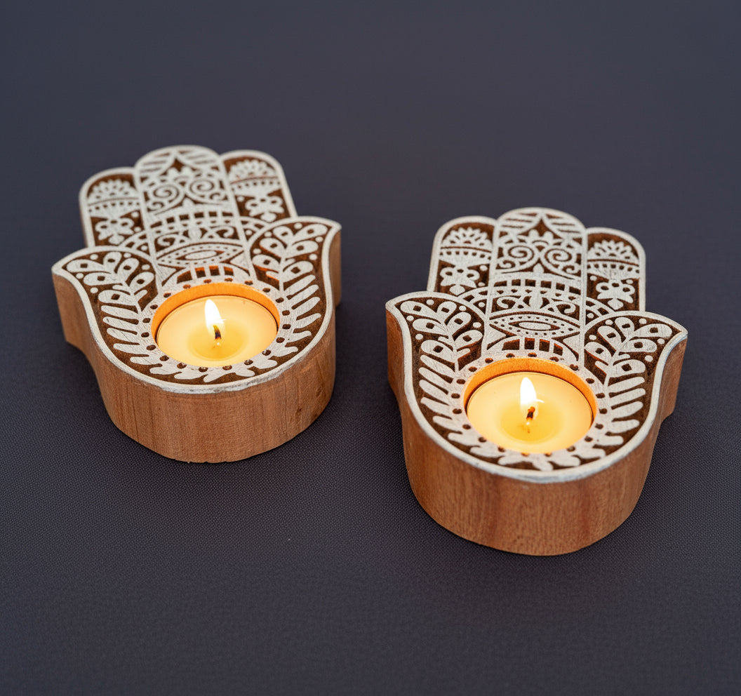 Hand-carved wooden tea light holders in various shapes, featuring intricate designs and natural finishes, adding a rustic, artisanal touch to your home decor.