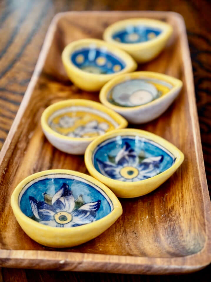 Handcrafted Jaipur Blue Pottery diyas, featuring intricate patterns and vibrant blue tones, perfect for adding a traditional Indian touch to your festive celebrations.