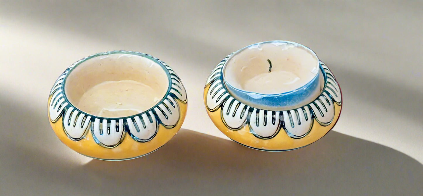 Handcrafted Jaipur Blue Pottery tea light holders, featuring intricate designs and vibrant blue hues, adding a traditional Indian touch to your home decor.