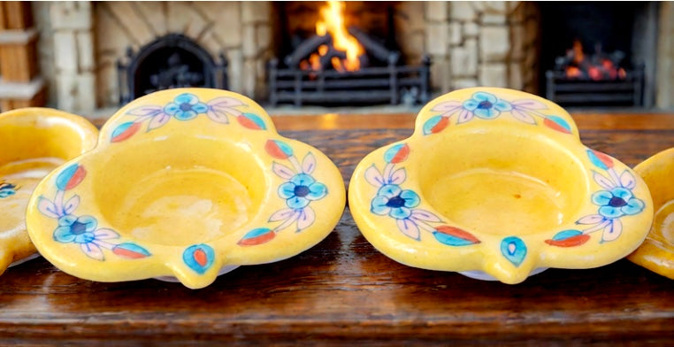 Handcrafted Jaipur Blue Pottery tea light holders, featuring intricate designs and vibrant blue hues, adding a traditional Indian touch to your home decor.