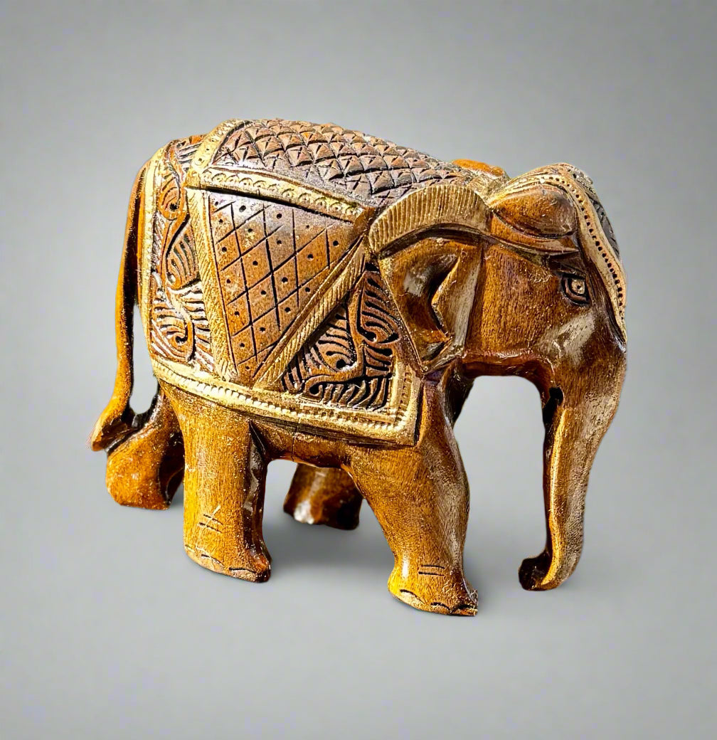 Alankaar - Figurines and Ornaments, intricately carved wooden elephant figurine showcasing detailed craftsmanship.