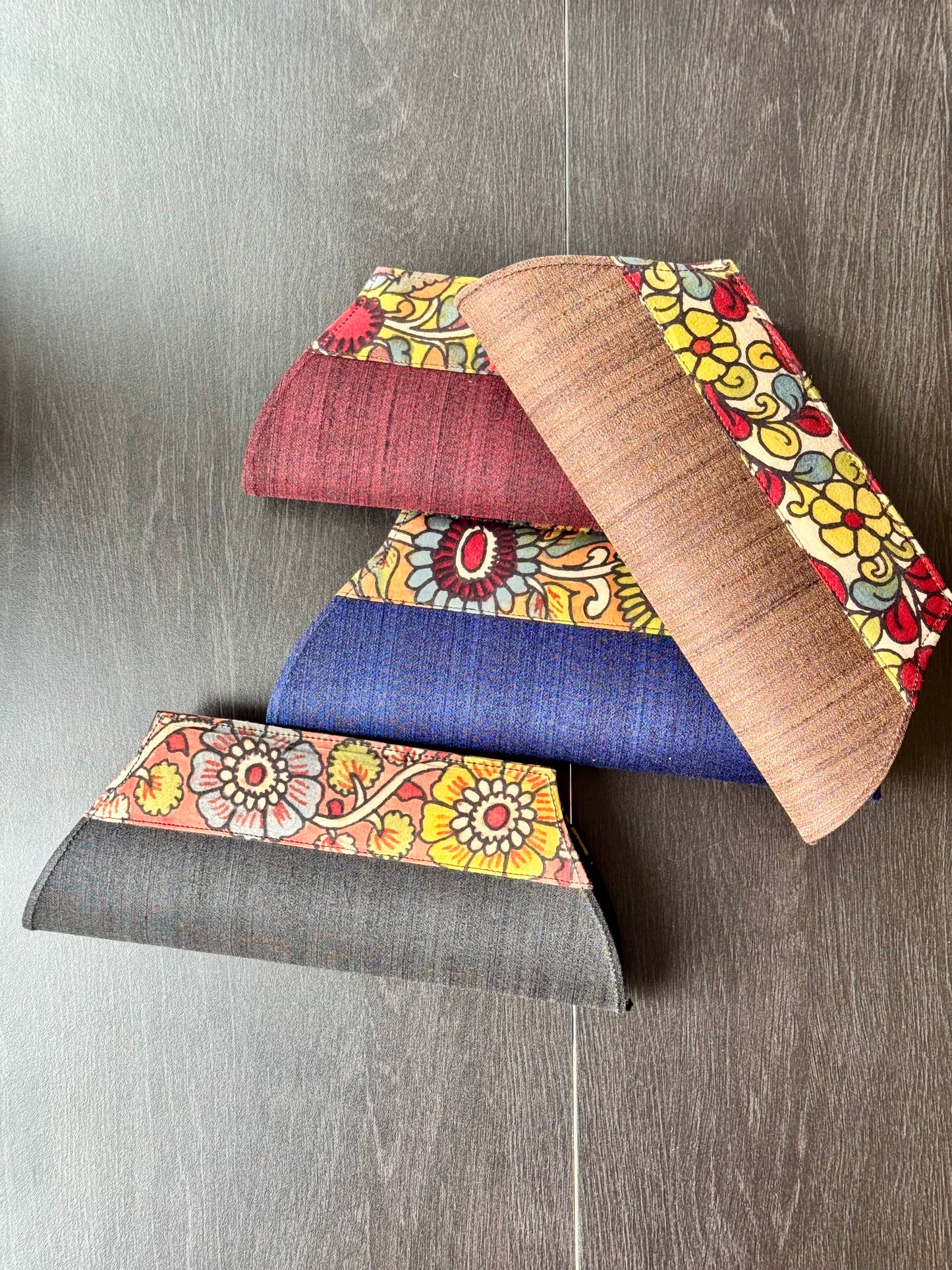 Four clutch bags in different colors 