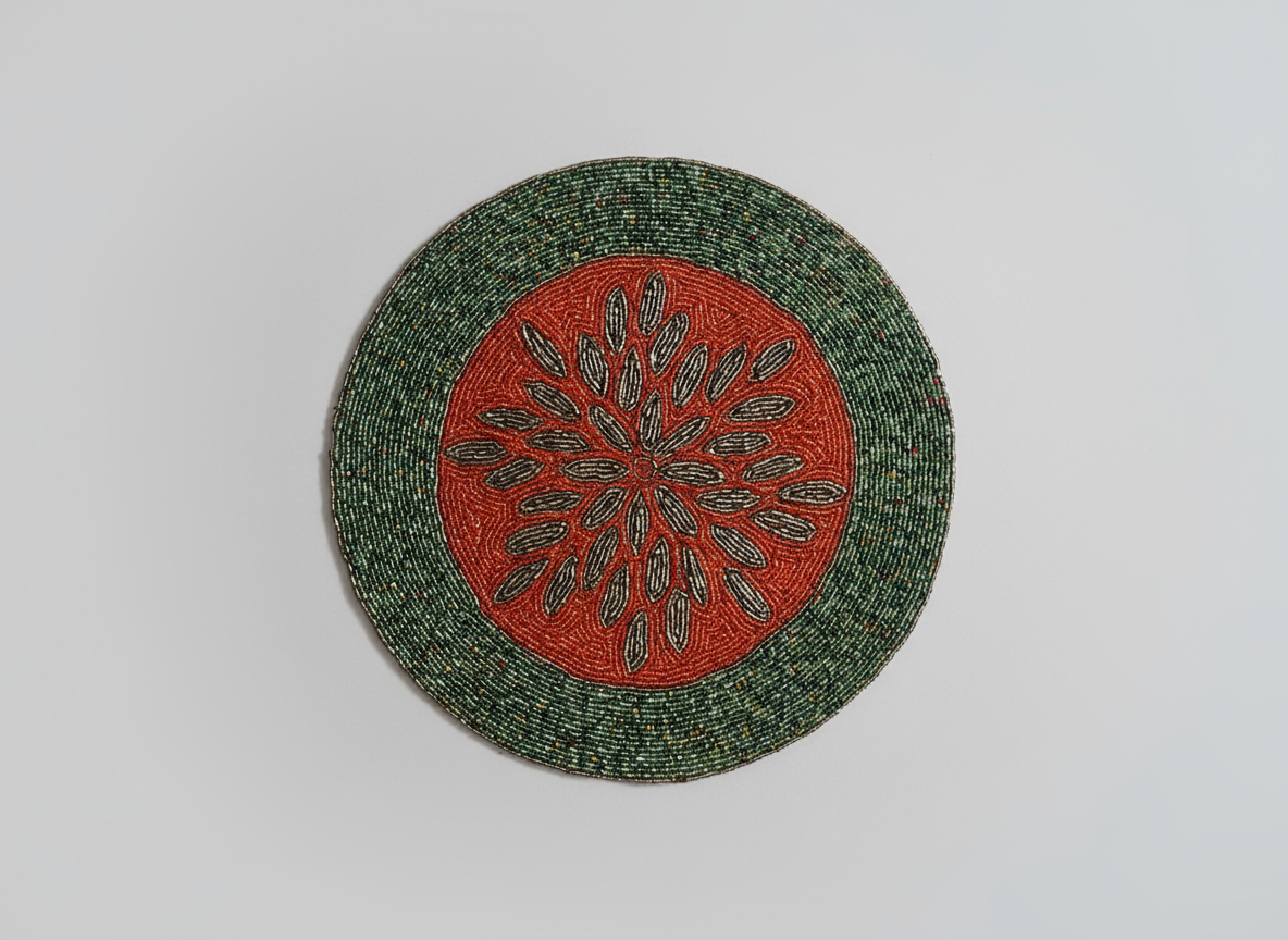 Round woven placemat with a red center and green border on a light gray background