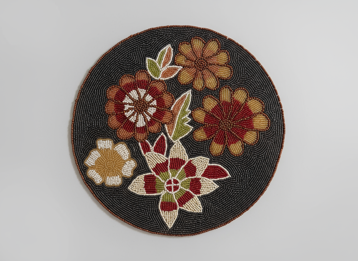 Circular embroidered patch with floral design on a plain background