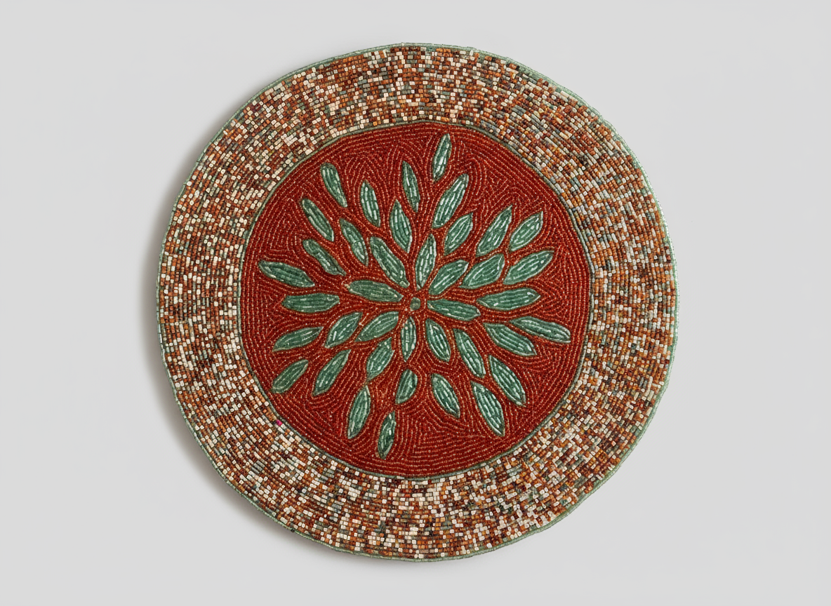 Round woven mat with a red center and green leaf pattern on a light gray background