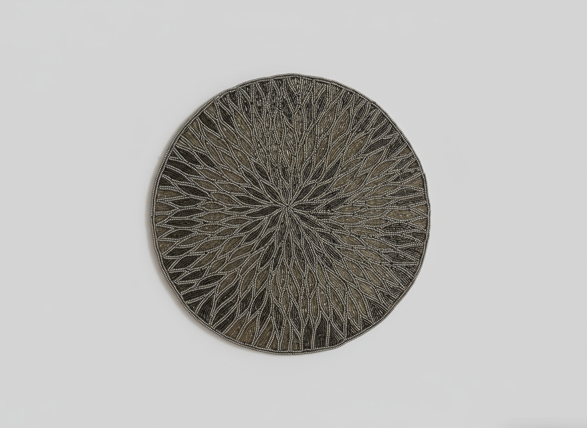 Round woven mat with a geometric pattern on a light gray background