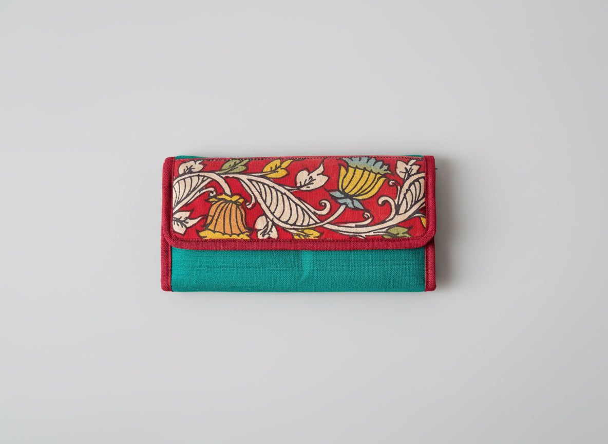 Authentic Kalamkari fabric evening clutch featuring vibrant hand-painted Indian motifs and artisanal detailing. Front of the lutch