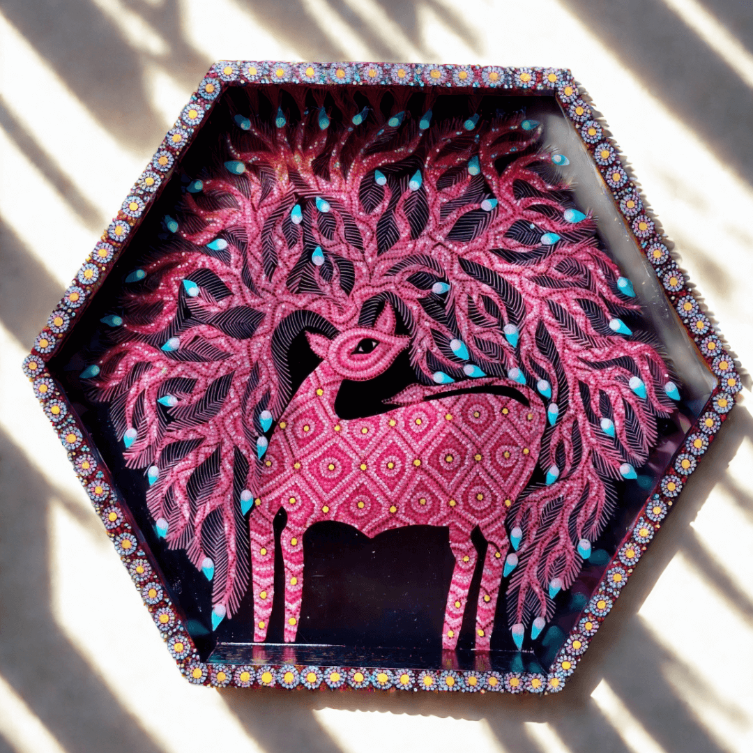 Decorative pink deer Bhil wall art /tray with intricate patterns on a white background